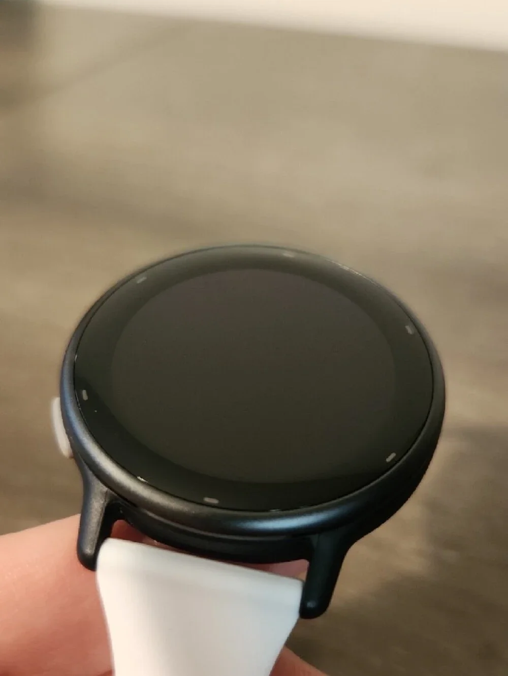 garmin white silicone smartwatch with black watch face